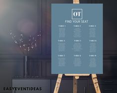 an easel with a seating chart on it