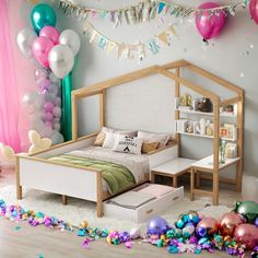 a bedroom decorated with balloons and streamers