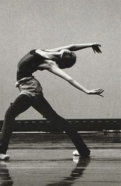 black and white photograph of a man doing a dance move