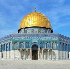 the dome of the rock in the middle of an open area with blue and gold tiles