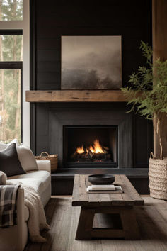 a living room filled with furniture and a fire place next to a large window on top of a wooden floor