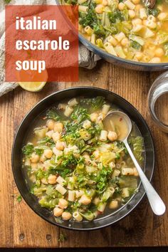 italian escarole soup with white beans and kale in a black bowl on a wooden table