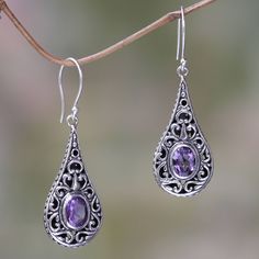 Amethyst is scintillating in sterling silver earrings from Komang Wijayana. Expertly crafted by hand with 2.5 gemstone carats the earrings are brimming with the graceful elegance of Balinese artistry. .925 Sterling silver