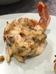 a white plate topped with food on top of a counter