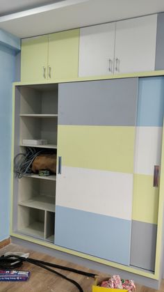 an empty closet is shown with the door open and shelves in place to hold items