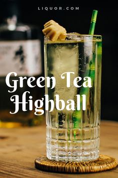 a green tea highball in a tall glass on a wooden table with the words, green tea highball