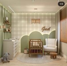 a baby's room with green walls and furniture