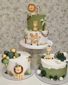 three tiered cakes decorated with jungle animals