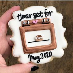 a decorated cookie that says time set for may 2012