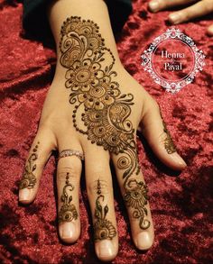 henna tattoo on the palm of a woman's hand