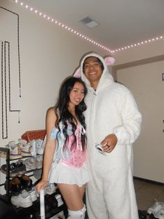 a man and woman dressed up in bunny costumes