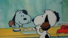 a charlie brown and snoopy eating cake together