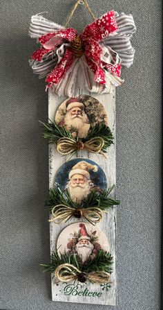 three christmas ornaments hanging on a wall