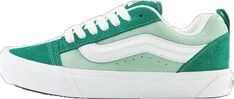 a pair of green and white sneakers