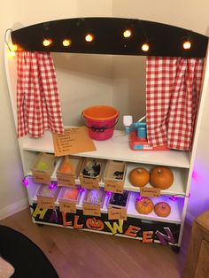 a shelf filled with lots of halloween decorations