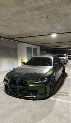 two cars are parked in a parking garage