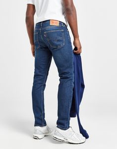 Elevate your style with a timeless staple in these men's 515 Slim Jeans from Levi's. In a Slept In Blue wash, these slim-fitting jeans are cut from stretchy denim cotton for durable comfort when on the move. They have a zip fly, a button fastening and belt loops for a secure wear, while the five pocket design offers space for all your essentials when stepping out. Signed off with the branded leather patch and the Red Tab logo to the rear. Machine washable. | Our model is 6'2" and wears a size 32R. Fitting Jeans, Student Discounts, Denim Cotton, Jd Sports, Leather Patches, Slim Jeans, Pocket Design, Levi's, Sports