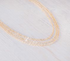 "~ Simplicity Choker~ Dainty choker chain, you can choose 1, 2, 3 layers as shown; all layers are attached to one clasp and can't be separated. This choker necklace can be layered with your other necklace collection and also be worn alone. Comes with 3\" extension chain ▸▸ Material ◂◂ All components are 14K gold filled. ▸▸ Layers◂◂ Comes in 1 / 2 / 3 layers, choose the number of layers you want. ▸▸ Necklace Length ◂◂ 13\" + 3\" extending chain. Leave a note at checkout if you want a different le Yellow Gold Layered Chain Necklace As Gift, Yellow Gold Layered Chain Necklace Gift, Gift Yellow Gold Layered Chain Necklace, Delicate Yellow Gold Layered Necklace Gift, Delicate Yellow Gold Layered Necklace For Gift, Dainty Layered Cable Chain Necklace For Gifts, Yellow Gold Chain Choker As Gift, Delicate Layered Chain Necklace As Gift, Delicate Layered Chain Necklace Gift