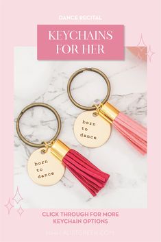 the keychains for her are shown in gold, pink and red tassels