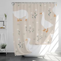 a shower curtain with ducks and daisies on it