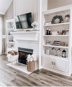 a living room filled with furniture and a flat screen tv on top of a fireplace