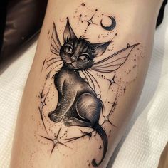 a black cat sitting on top of a person's leg with stars around it