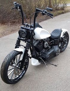 a black and white motorcycle parked on the street