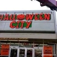 a halloween city store front with the words halloween city written on it's side