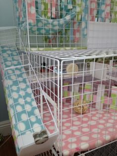 two small cages filled with stuffed animals on top of a floor next to each other