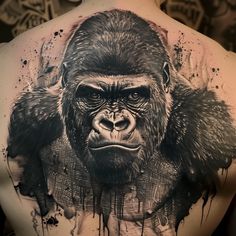 a man's back with a gorilla tattoo on it