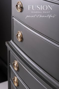 a metallic dresser with the words fusion painted on it