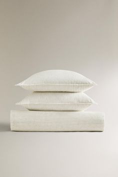 three pillows stacked on top of each other