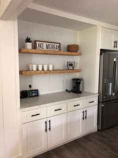 the kitchen is clean and ready to be used as a place for coffee or tea