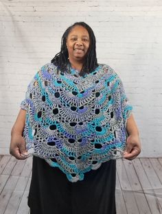 Beautiful handmade poncho for flare. Great addition to any outfit. Poncho is designed to fit loose on most women's bodies. Definitely looks great for a plus size 2x or 3x. Made with soft acrylic yarn. View pictures for measurements. Machine washable & dryable. Do not bleach and do not iron. Enjoy. Thank you for viewing my poncho from Celebrated Crochet. Oversized Shawl Poncho, Casual One Size Shawl Poncho, Blue Oversized Poncho, Handmade One Size Poncho Shawl, One Size Multicolor Shawl Cape, Multicolor Shawl Cape One Size, Multicolor One-size Shawl Cape, Multicolor Cape Shawl One Size, One Size Blue Cape