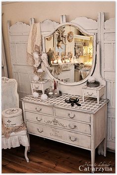 an antique dresser and mirror in a room