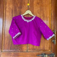 Hand embroidered ready made saree blouse / crop top/stitched saree blouse usa / purple saree blouse/modern blouse/zardosi blouse/elbow sleeve saree blouse/cotton silk blouse/ maggam work blouse Well..!! we understand that you may not get in your desired size/pattern, here you go with customization according to your size/pattern which we can deliver in 1-2 weeks of time period !! Here is a beautiful Hand embroidered zardosi work crop top / blouse in purple color that has high neck with hand embro Purple Dola Silk Saree With Mirror Work, Purple Unstitched Blouse Piece For Puja, Purple Blouse With Resham Embroidery For Party, Purple Resham Embroidery Blouse For Parties, Purple Designer Blouse For Diwali, Designer Purple Blouse For Diwali, Purple Party Blouse With Resham Embroidery, Bollywood Style Art Silk Top With Mirror Work, Purple Blouse With Zari Work In Traditional Drape