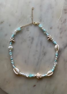 Bracelet Ideas Sea Beads, Micro Bead Necklace, Beachy Phone Charms, Beach Necklaces Aesthetic, Ocean Beaded Bracelet, Sea Beads Bracelet, Coastal Jewelry Aesthetic, Beachy Beaded Jewelry, Beachy Beaded Necklace