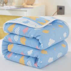 three baby blankets stacked on top of each other