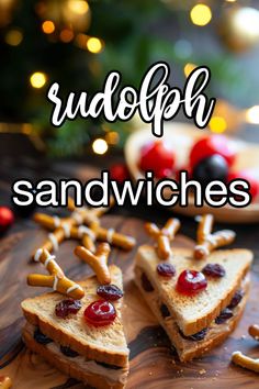 sandwich sandwiches with pretzels and crackers on a cutting board in front of a christmas tree