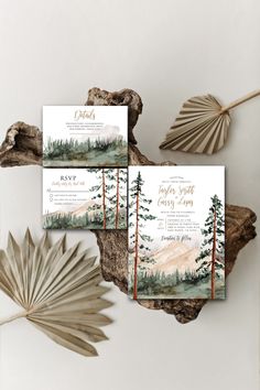 wedding stationery with pine trees and mountains