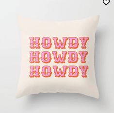 a white pillow with the words howdy hodwy printed in red on it