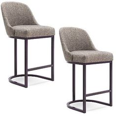 two gray chairs sitting next to each other on a white surface with one chair upholstered