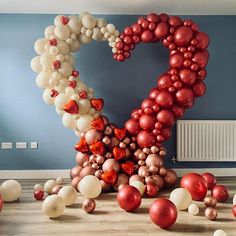 a number made out of balloons in the middle of a room