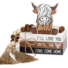 a wooden beaded bracelet with an image of a cow on it and the words, i'll love you until the cows come home