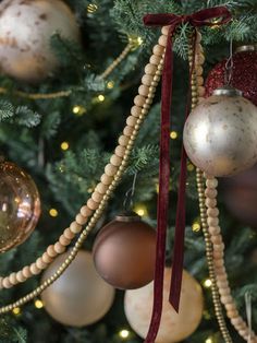 a christmas tree with ornaments hanging from it