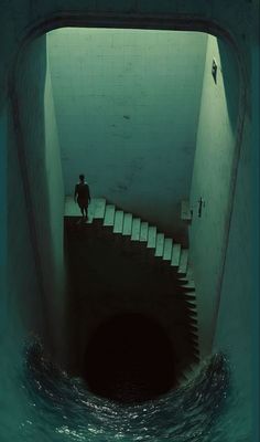 a man standing at the end of a tunnel with stairs leading up to it and water in front of him