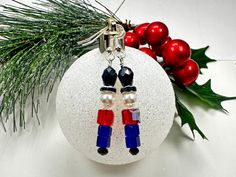 Nutcracker / Toy Soldier Holiday Earrings,  Made with love using Swarovski Siam (Red) Crystal beads, Blue Glass beads and silver findings.  Christmas Earrings, Christmas Gift, Office gift, Gift for anyone, Swarovski Crystal, Stocking Stuffers,  Christmas Jewelry Nut Cracker Christmas, Diy Christmas Shadow Box, Christmas Beading, Christmas Shadow Boxes, Nut Cracker, Gifts For Anyone, Holiday Earrings, Earrings Christmas, Holiday Earring