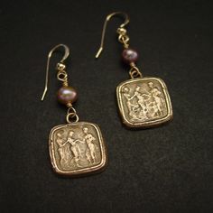 "Handmade reproduction of intaglio earrings representing this great Odyssey scene of Odysseus also known as Ulysses in Latin returning to his queen Penelope. The cameo represents Queen of Ithaca, Penelope, being led in secret by her lady in waiting to her husband, Odysseus, who went missing during the Trojan War. The Odyssey is a Greek epic poem traditionally attributed to Homer, describing the travels of Odysseus during his ten years of wandering after the fall of Troy. He eventually returned h Byzantine Jewelry With Matching Earrings For Anniversary, Intaglio Drop Earrings For Gift, Engraved Brass Earrings For Anniversary, Byzantine Style Pierced Earrings As Gift, Handmade Byzantine Wedding Earrings, Heirloom Engraved Earrings As Gift, Odysseus And Penelope, Antique Cameo Jewelry, Crow Necklace