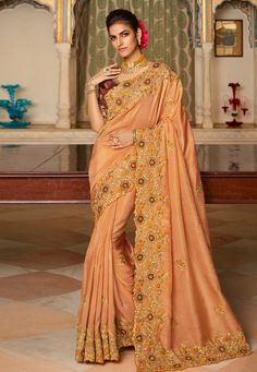 Peach viscose saree with blouse 7005  Desc:  Color : Peach Fabric : Viscose Work : Embroidery Wash Care : Dry clean Sleeve Style : Half Sleeve Long Sleeves : Done only in Custom Stitch Sleeves Lining : Done only in Custom Stitch Bust Size : 32 to 42 Inches Occasion : Festival   Diwali   Eid   Durga Pooja   Ganesh Charturthi   Dussehra. With Express Free Shipping and Custom Stitching, Buy Indian Wedding Party Wear Saree Peach viscose saree with blouse 7005 online in USA, UK and Canada from KollyB Peach Embroidery, Indian Wedding Party, Traditional Saree, Indian Sarees Online, Indian Wedding Wear, Sarees Collection, Embroidered Wedding, Saree Shopping, Wedding Saree