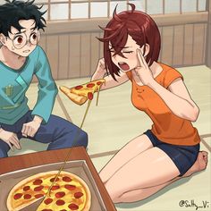 a man and woman sitting on the floor next to a box of pizza with one slice missing